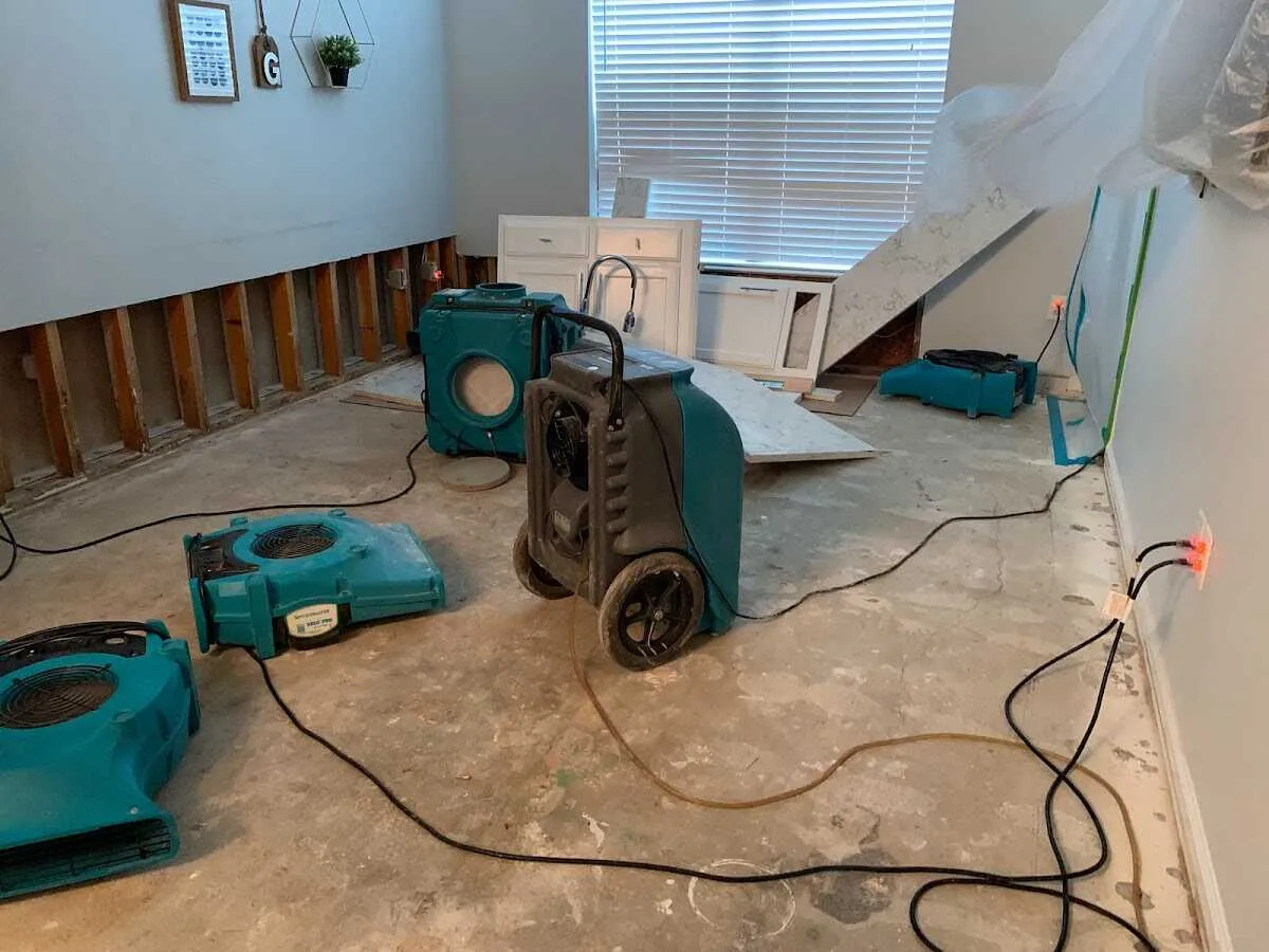 Dehumidifier in flood-cut room for Water Damage Restoration in Richmond